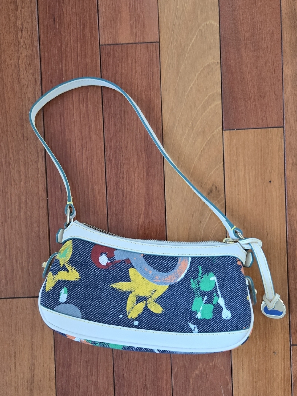 Dooney & Bourke Denim Grafitti Bag. Leather Trim. Interior Zip Pocket